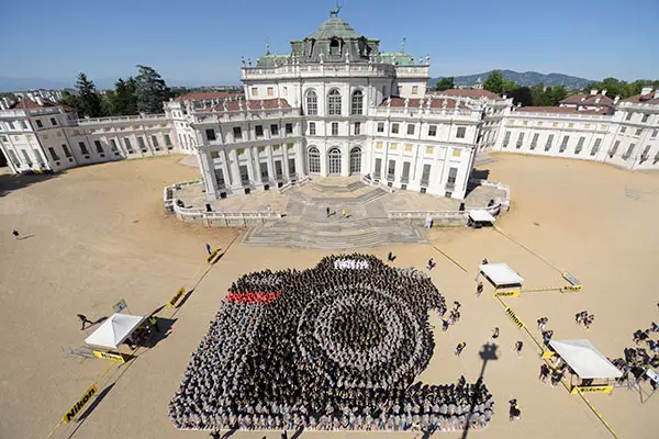 a group of people making a human image of a camera